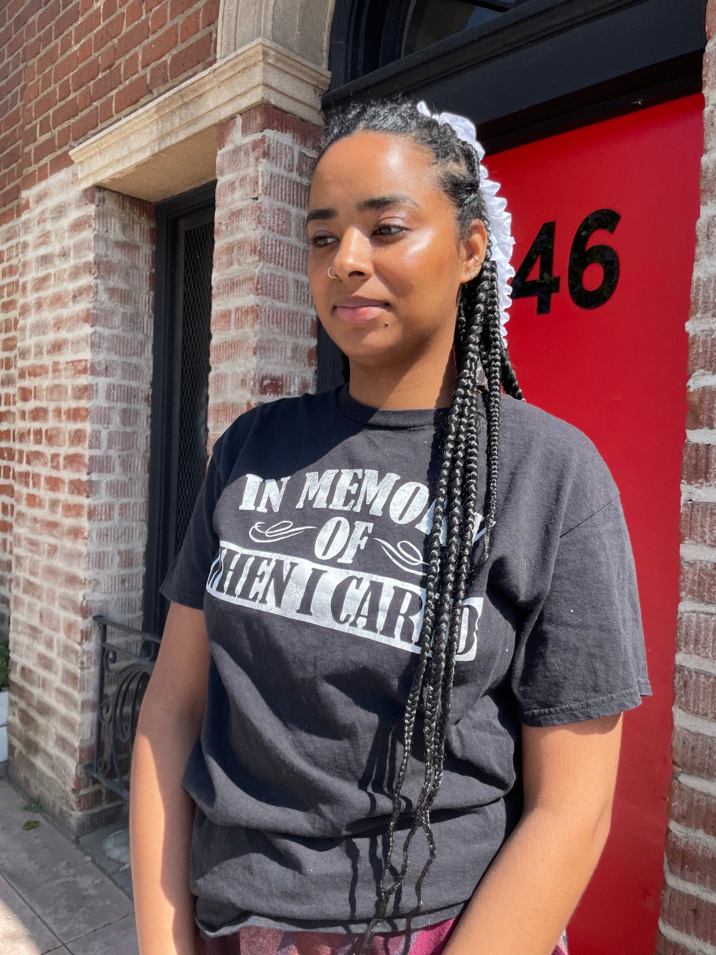 A girl wearing a tee shirt and skirt.