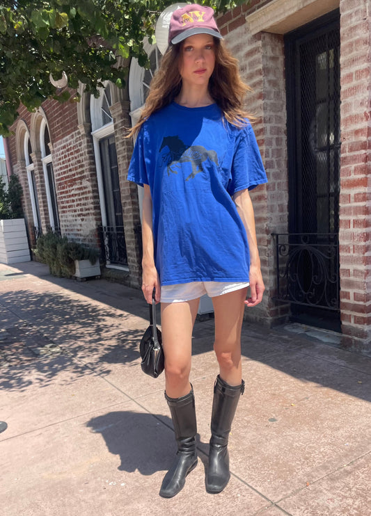 girl in navy shirt and white shorts