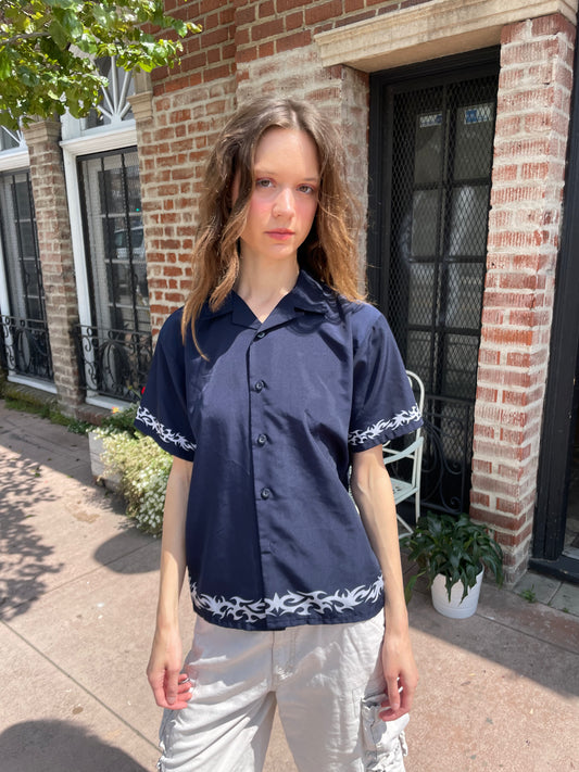 girl wearing a button up blue shirt 