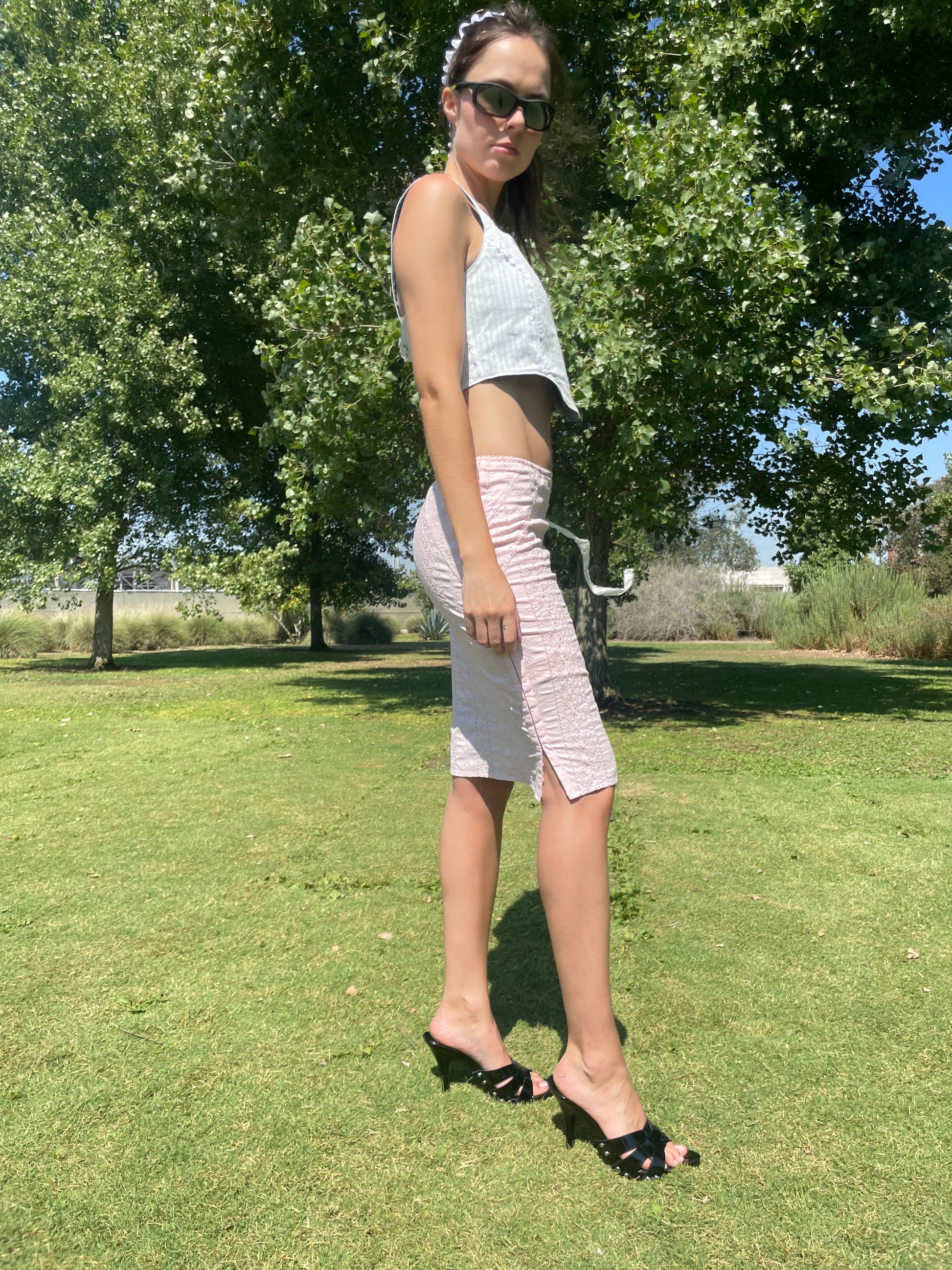 girl in pink skirt and blue corset top