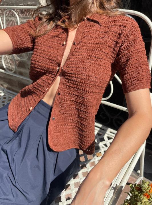 girl in navy skirt and brown button up