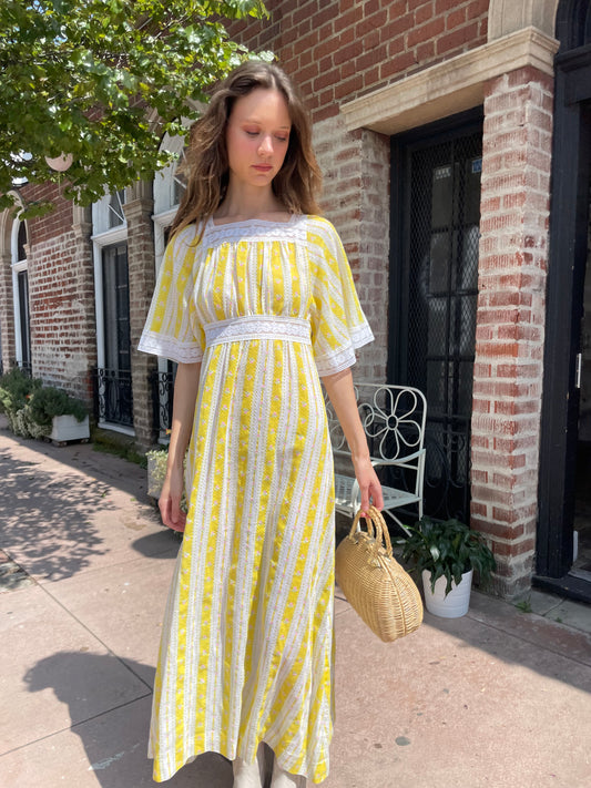 girl wearing long yellow and lace dress