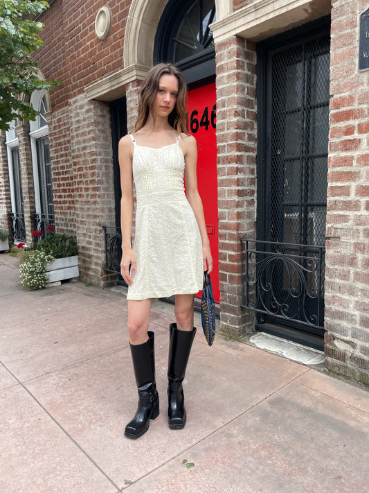 girl wearing strappy cream dress