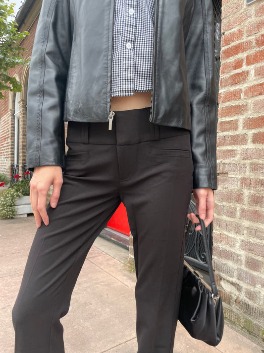 girl wearing leather jacket and black pants