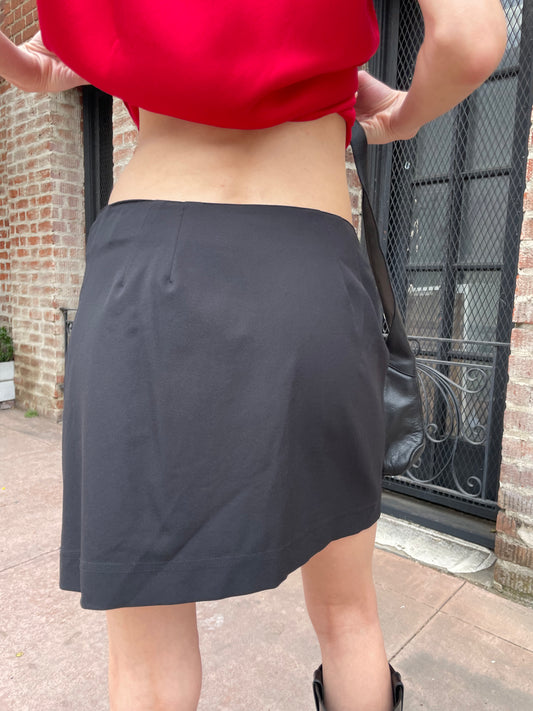 girl in black skirt and red top