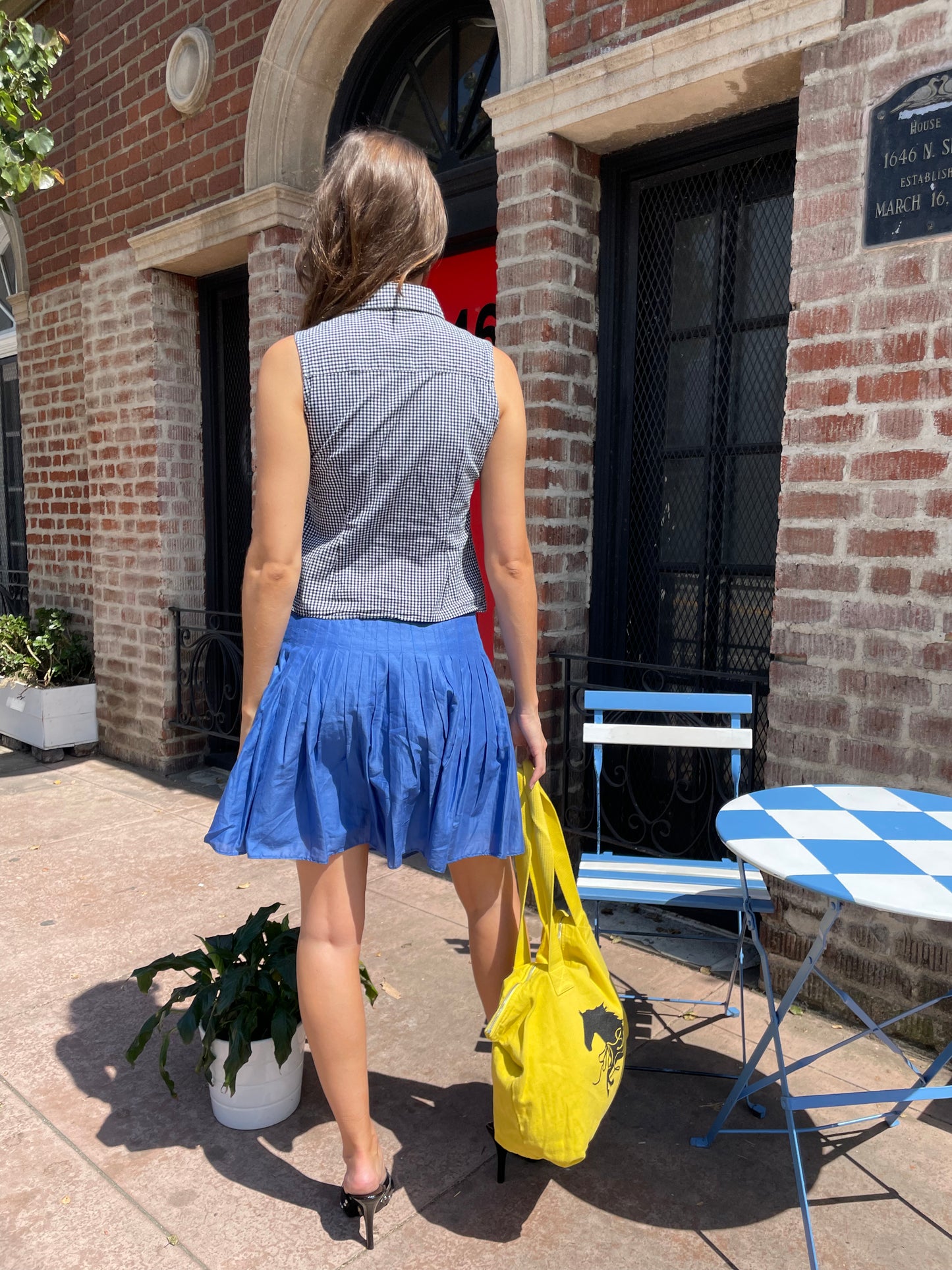 girl in blue skirt and checkered top