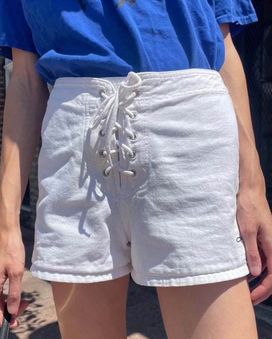 girl in white shorts and blue t-shirt