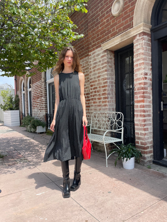 girl wearing black dress and black boots