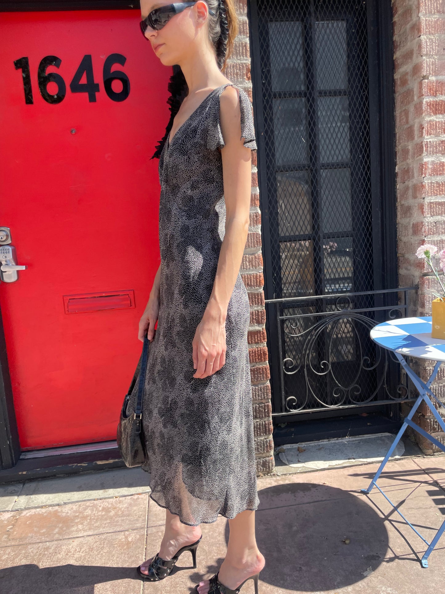 girl in black and white polka dot dress