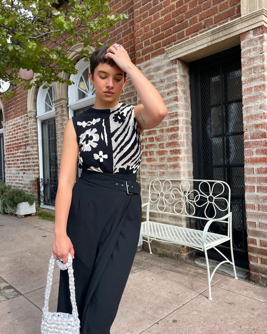 girl wearing black and white top and black skirt