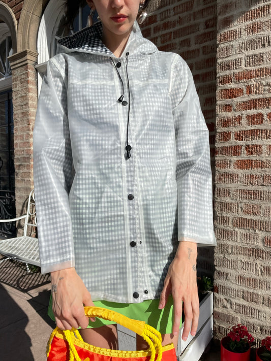 girl wearing gingham rain jacket