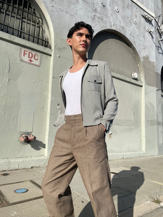 boy wearing grey jacket and tan slacks