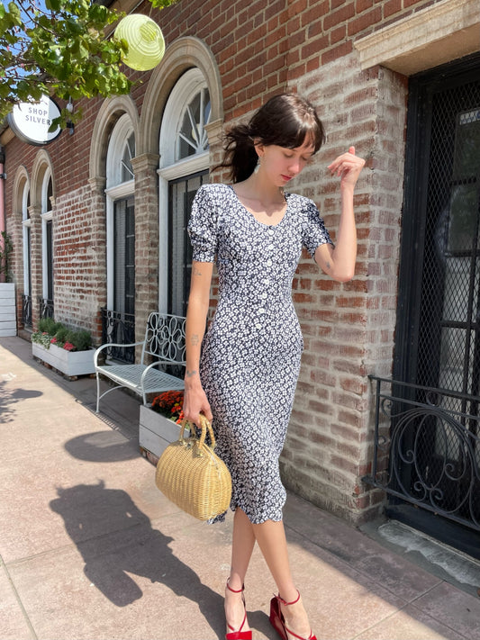 girl wearing black and white floral dress
