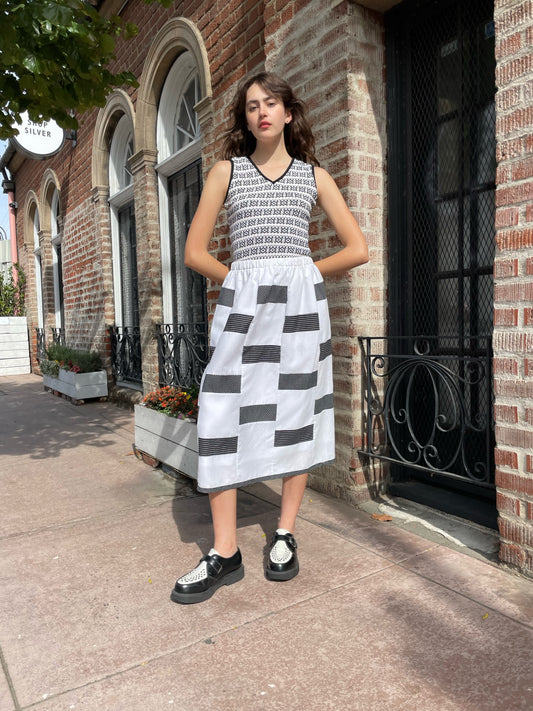 girl wearing black and white shirt and skirt