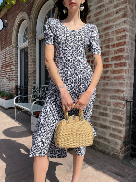 girl wearing black and white floral dress